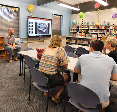 Chief Joseph School Library - Adults watching a powerpoint presentation in the newly updated library.